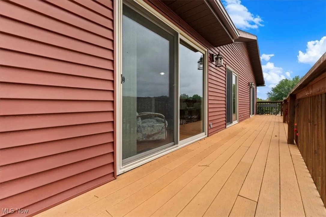 View of deck full length of the house with TREX flooring.