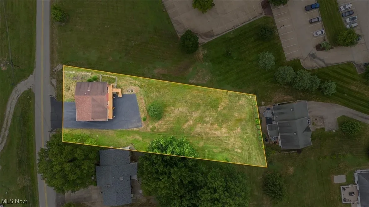 Aerial view of property's location featuring property boundaries highlighted. Lot size is F 82.31x 251.42x 49.84x 255.06.  There are markers on each corner.  Right side of 49.84 (back) goes between 4th and 5th bush.