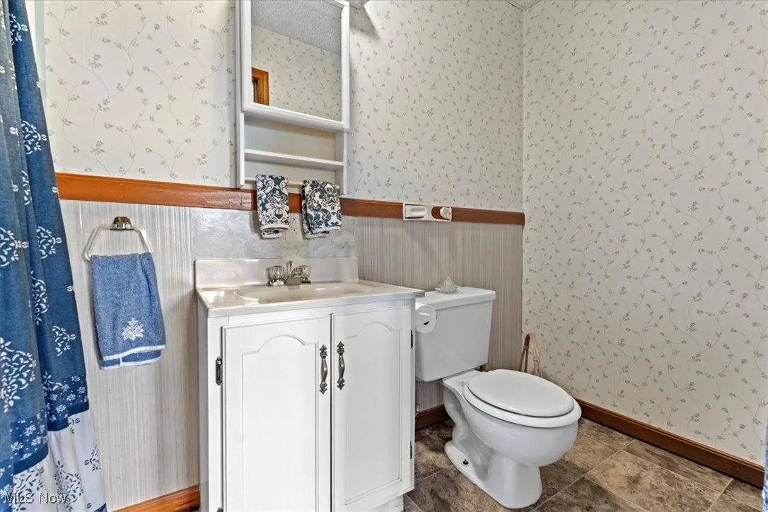 Full Bathroom featuring vanity, shower and tile patterned flooring located in #3 bedroom