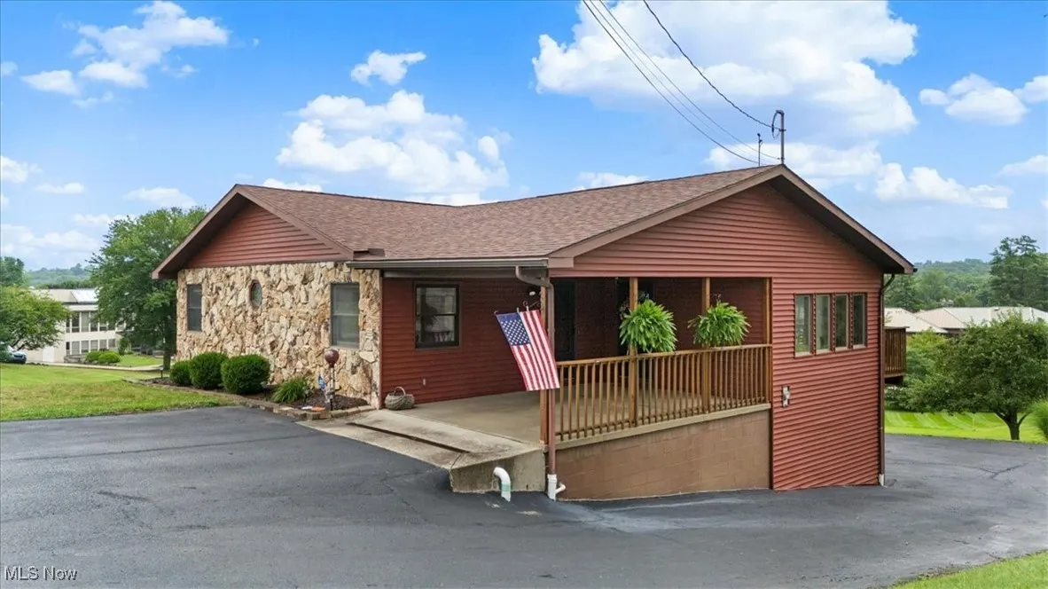 Offering almost 1800 fin. sq. ft. featuring a covered carport, garage, workshop area & storage room.  Upper level has LR, DR, Kit, Bath, 2 BRs and laundry. Lower level has 1 BR, bath, and Den. Located outside of City Limits.