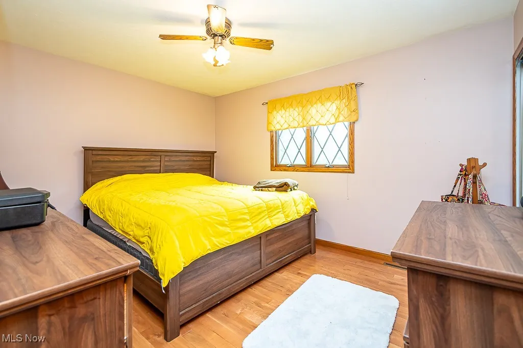 Bedroom featuring light wood flooring and ceiling fan