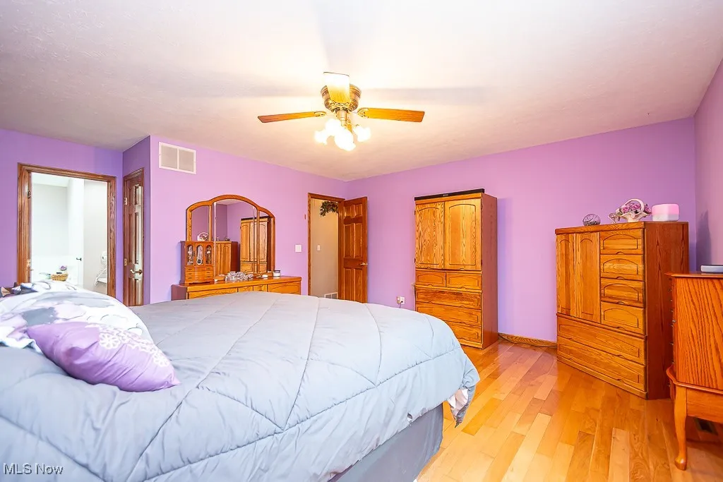 Bedroom featuring light wood finished floors and a ceiling fan