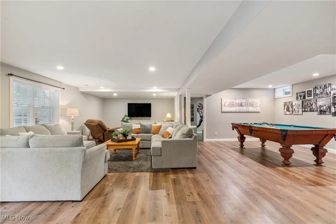 Living area featuring light wood-style flooring, pool table, and recessed lighting