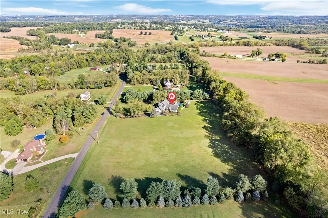 Aerial view of property and surrounding area with rural landscape