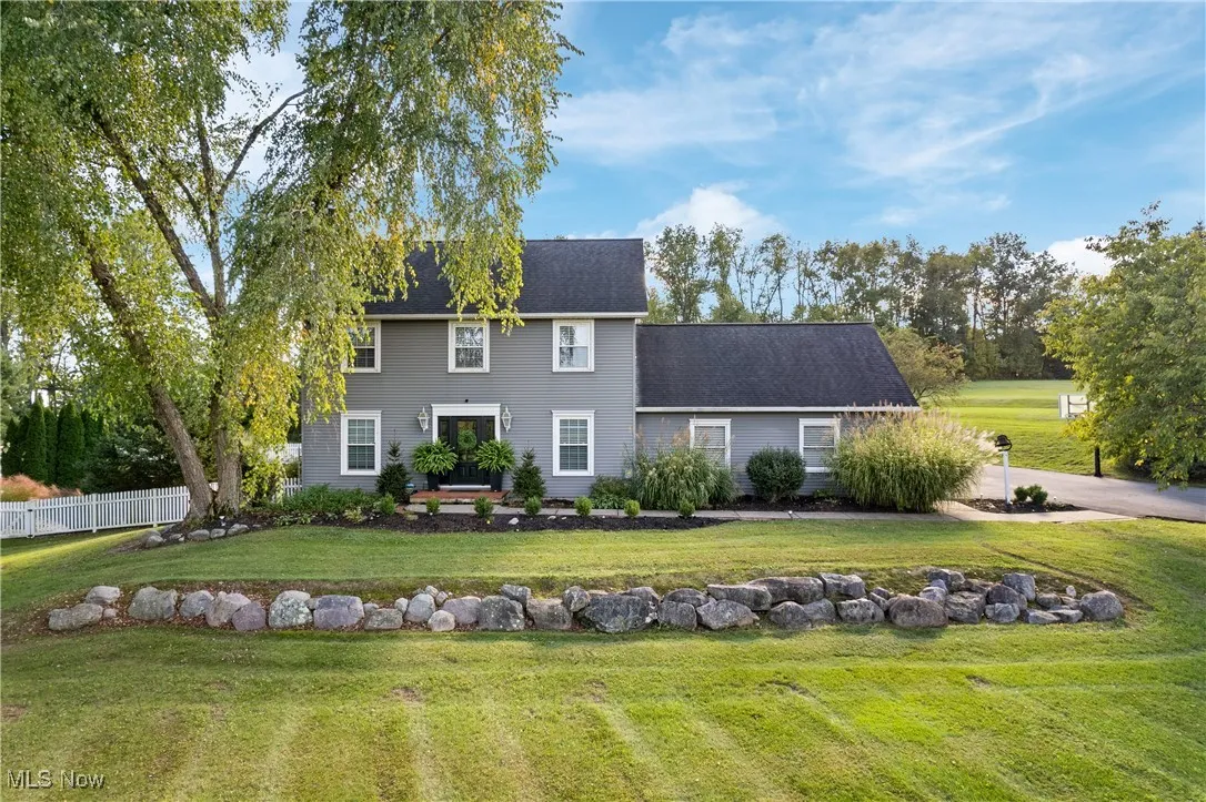View of front of property with roof with shingles
