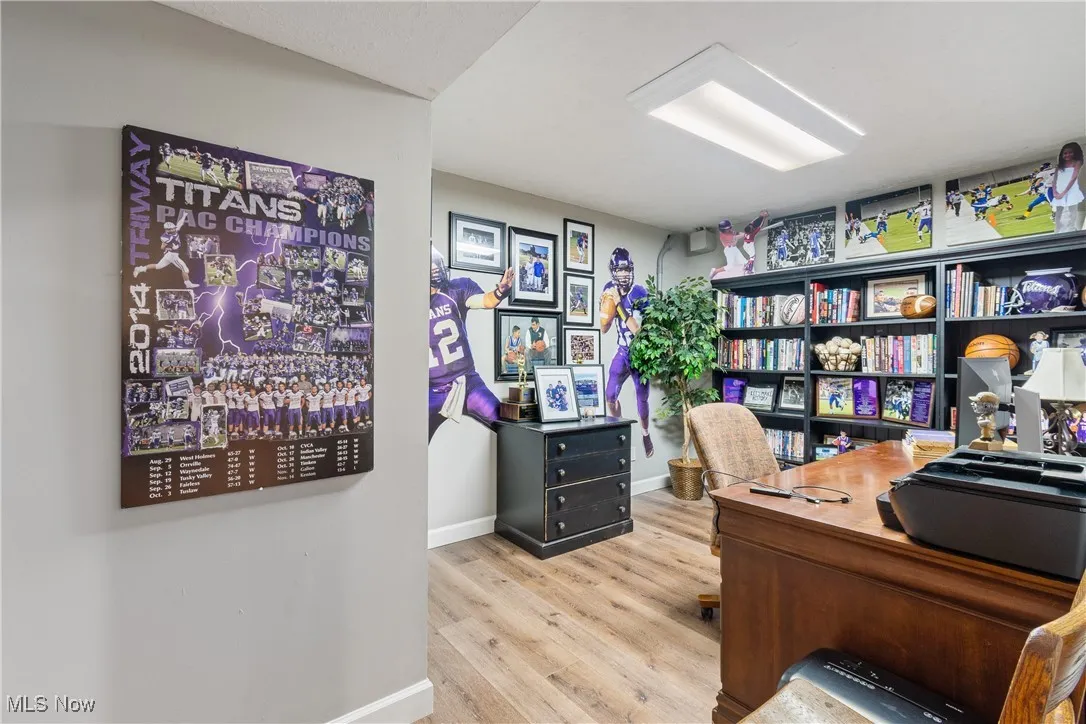Office area featuring wood finished floors and baseboards