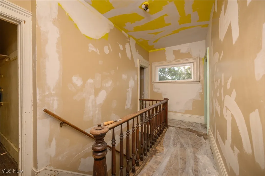 Stairs featuring marble finish flooring