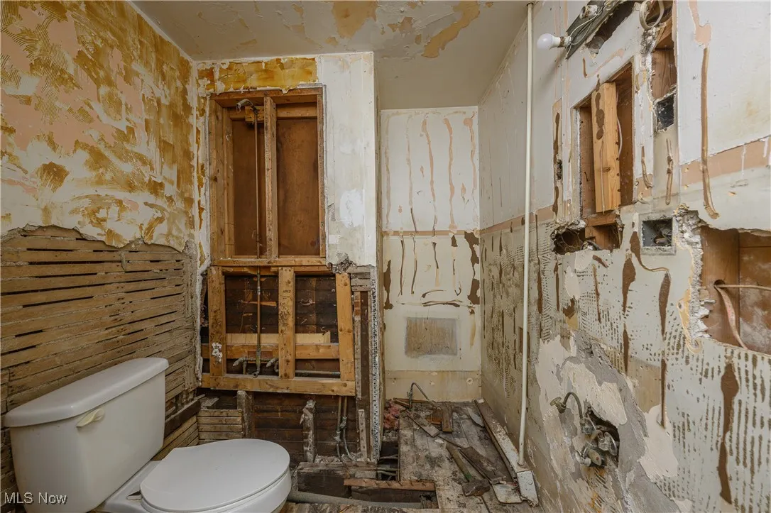 Half bath featuring toilet