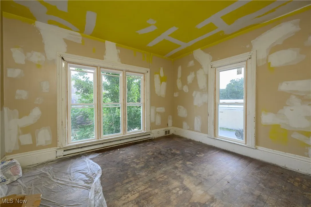 Spare room featuring a baseboard radiator