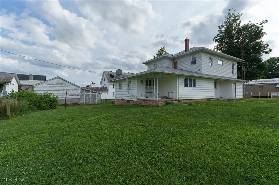 Back of property featuring a chimney