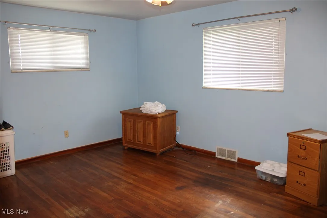 Unfurnished bedroom featuring wood finished floors