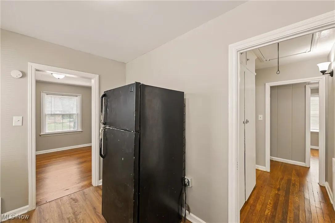 Kitchen featuring freestanding refrigerator and hardwood / wood-style flooring