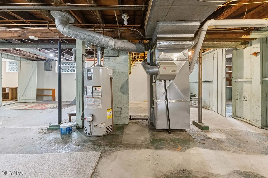 Basement featuring water heater