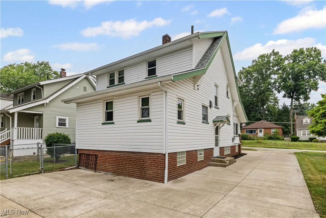 View of property exterior featuring a chimney