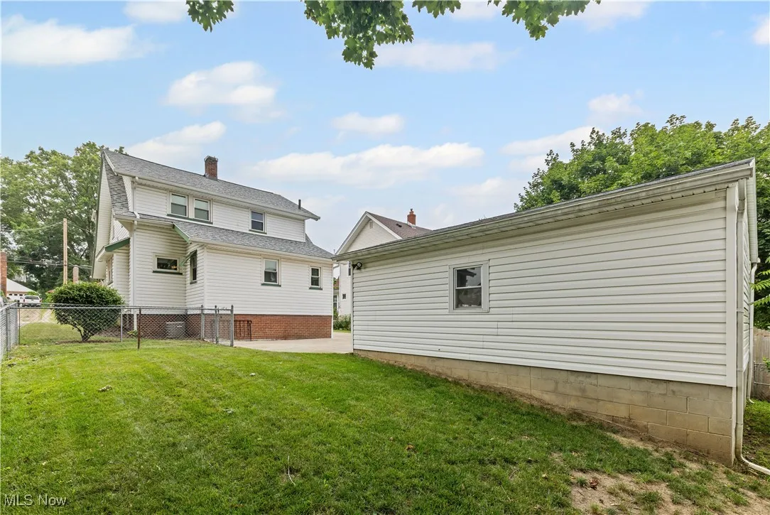 Rear view of property featuring a patio area