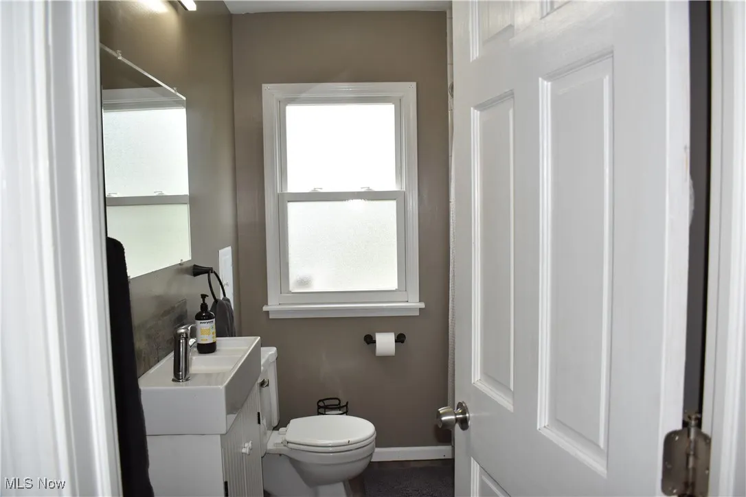 Bathroom with vanity and baseboards