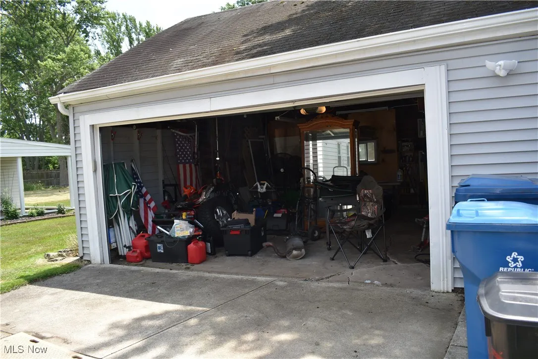 Garage featuring concrete driveway