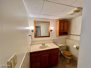 Bathroom with vanity and a paneled ceiling