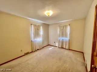 Spare room with carpet floors