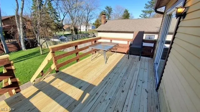 Wooden deck with a yard