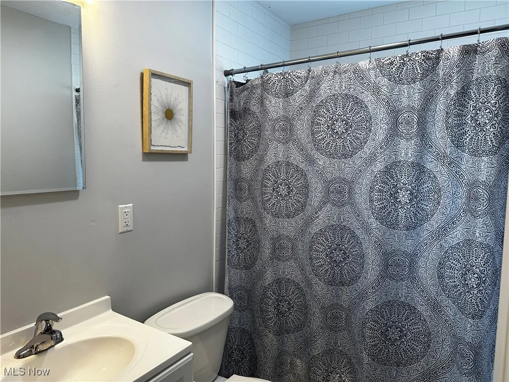 Bathroom featuring vanity and a shower with curtain