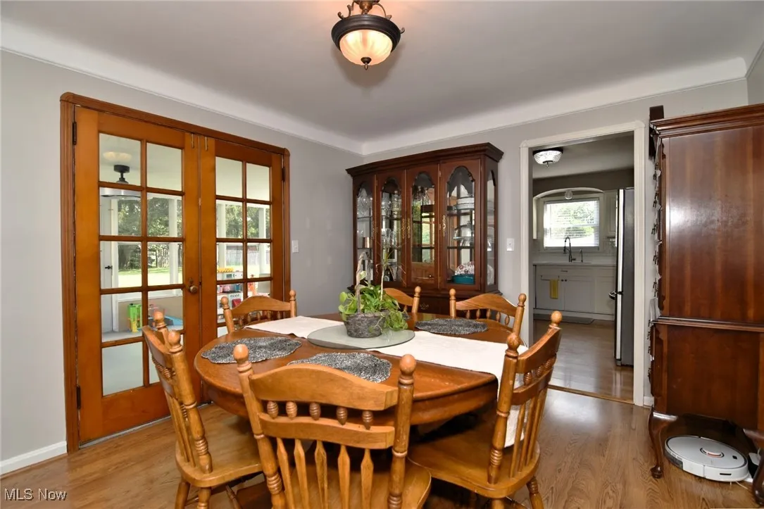 Dining room with french doors to sun room.