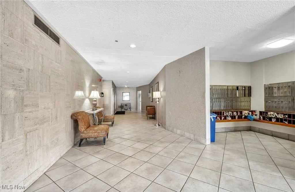 Building lobby with a textured ceiling and recessed lighting