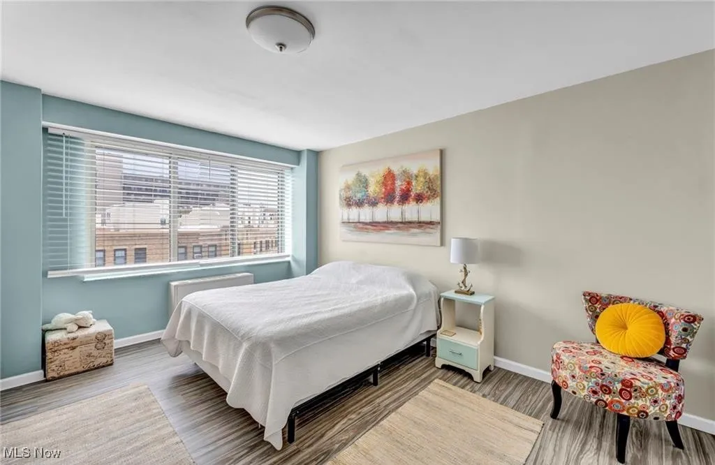 Bedroom featuring wood style floors