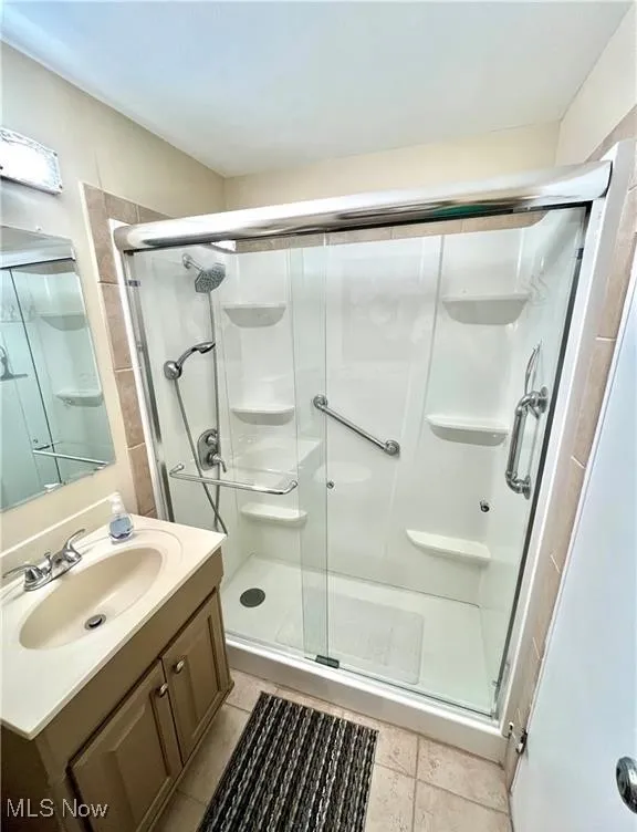 Bathroom with a walk in shower and vanity