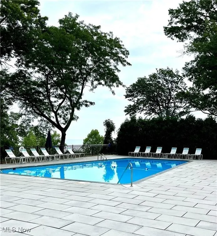Community pool featuring a patio area