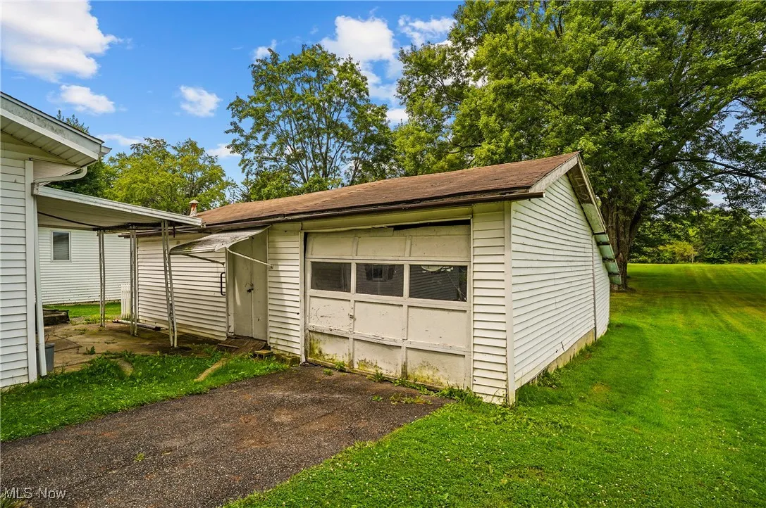 Garage with asphalt driveway