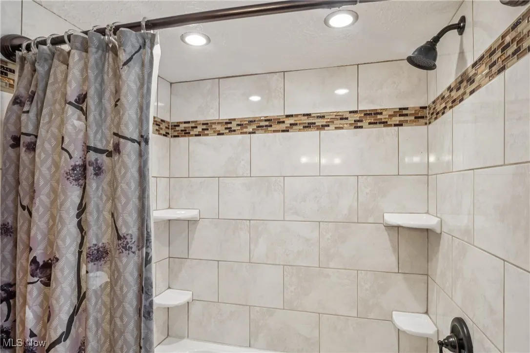 Second floor bathroom featuring shower / bath combo and recessed lighting