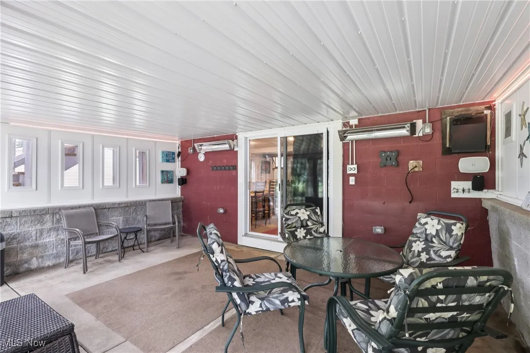 Lower level walk-out to heated 4 season / sun room