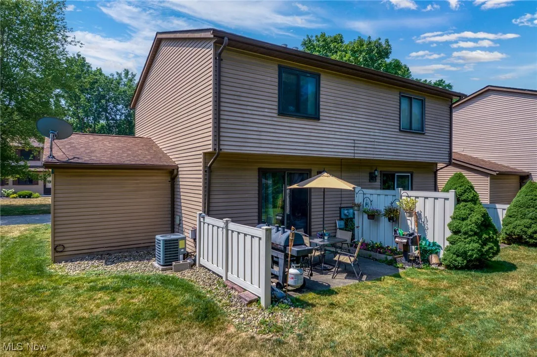 Back of house featuring a yard and a patio