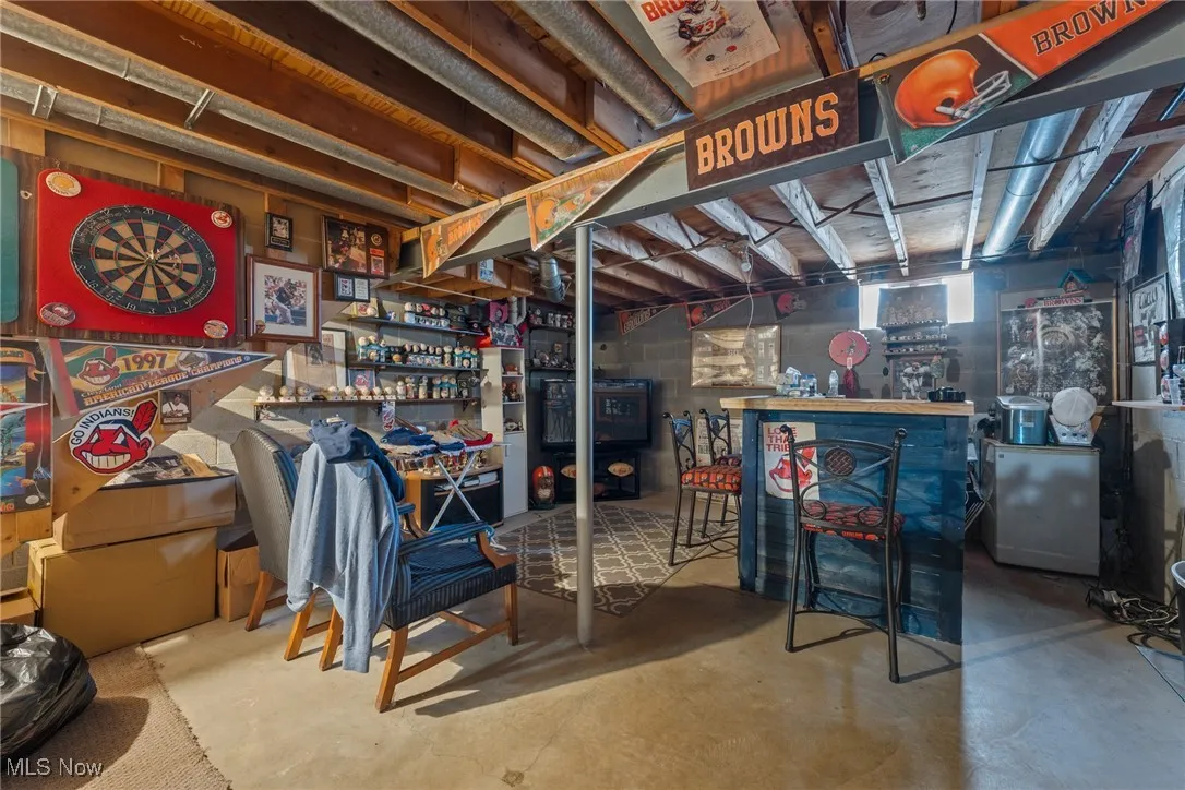 Basement with a bar and fridge