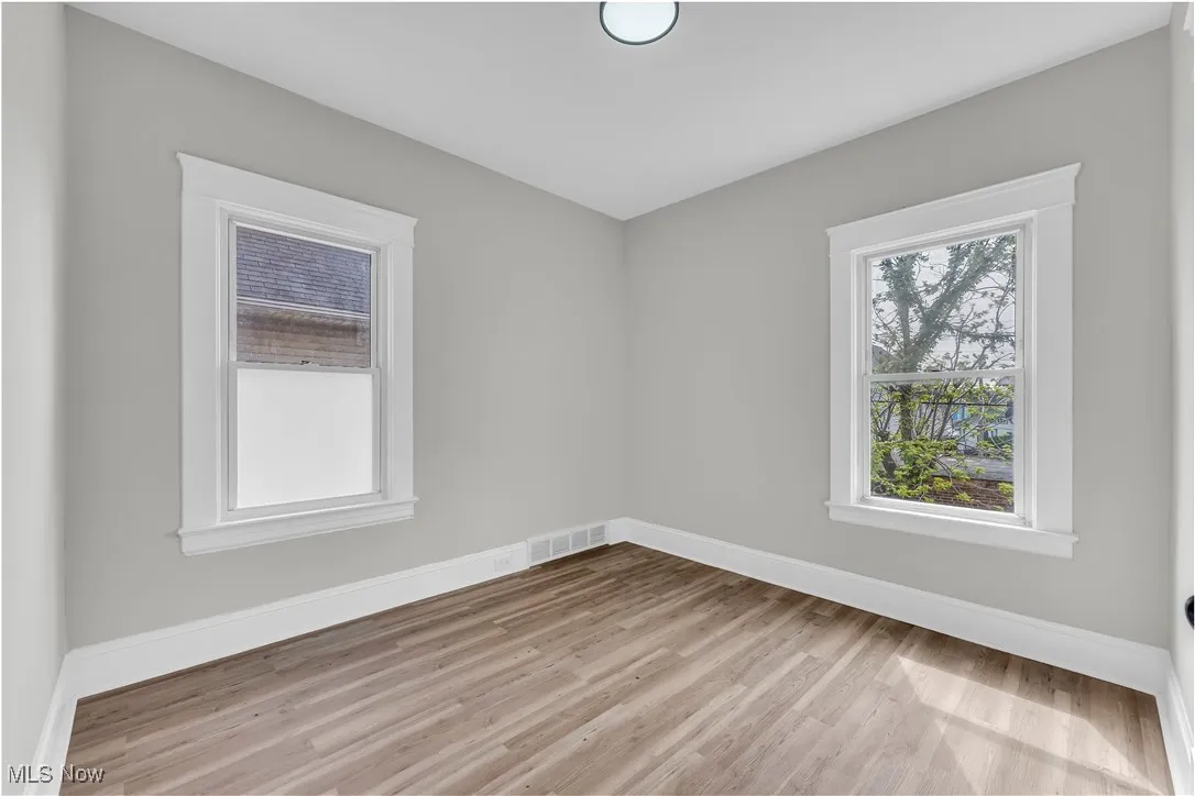 Empty room featuring wood finished floors