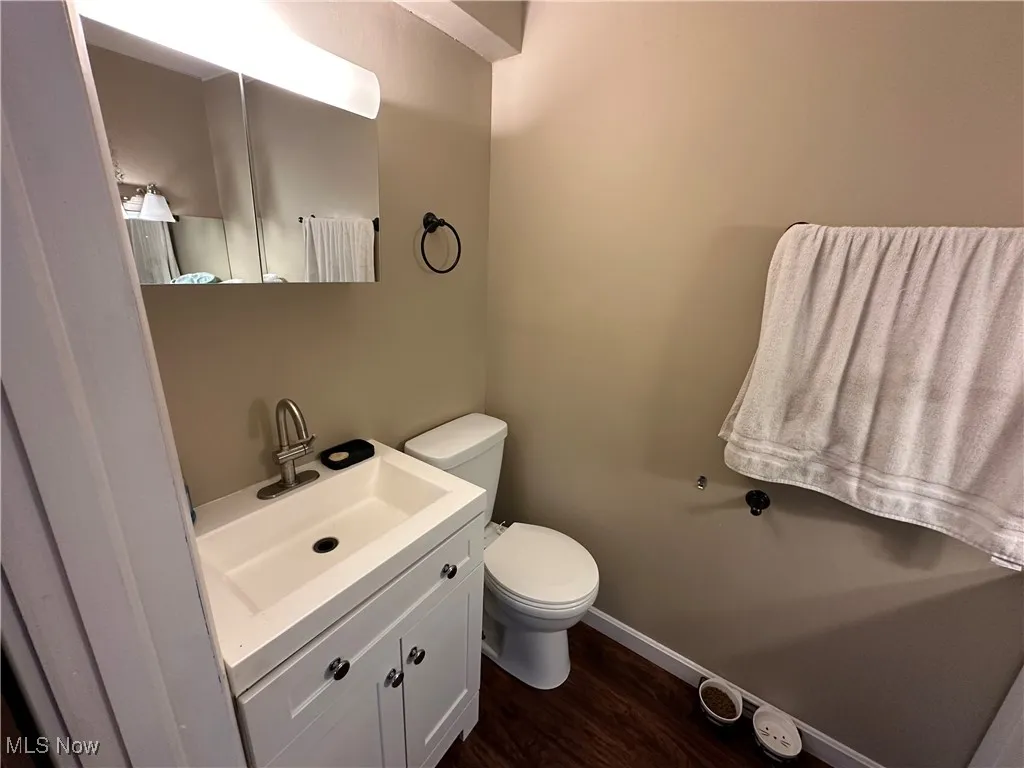 Bathroom featuring vanity and wood finished floors