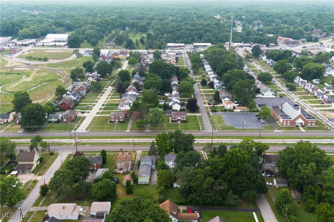 Aerial overview of property's location with nearby suburban area
