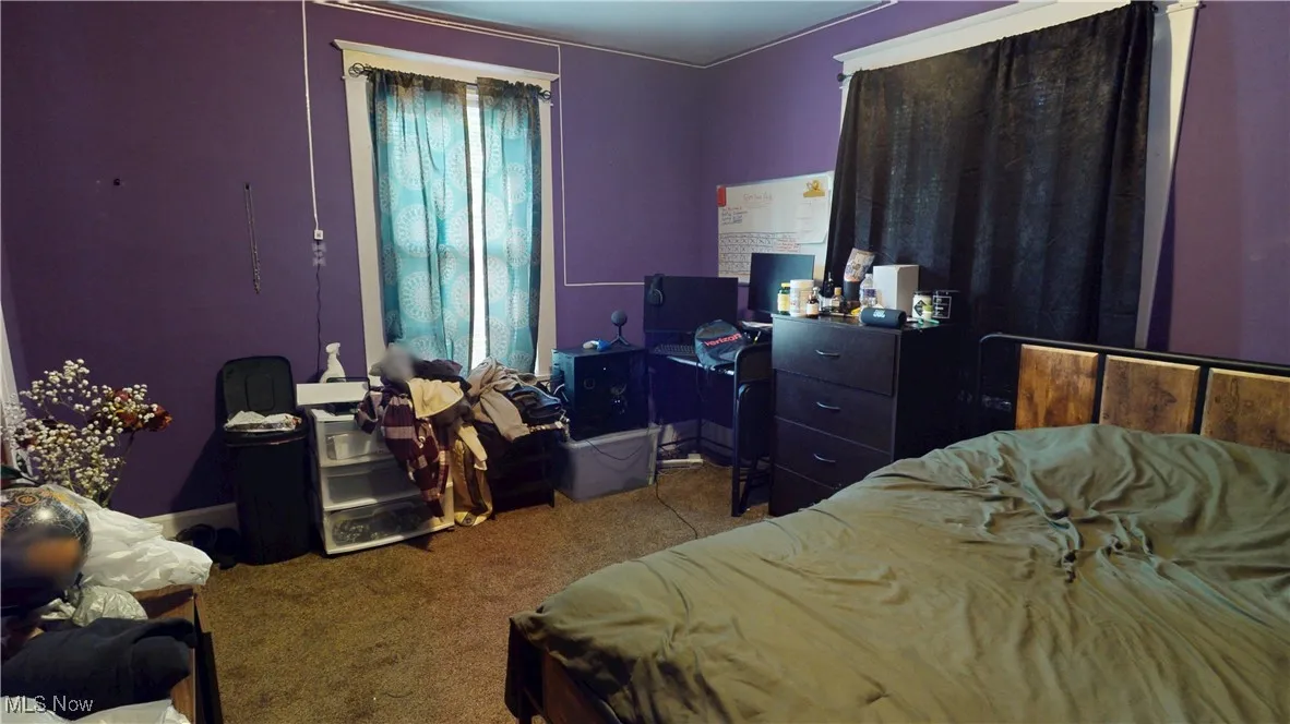 Bedroom featuring carpet