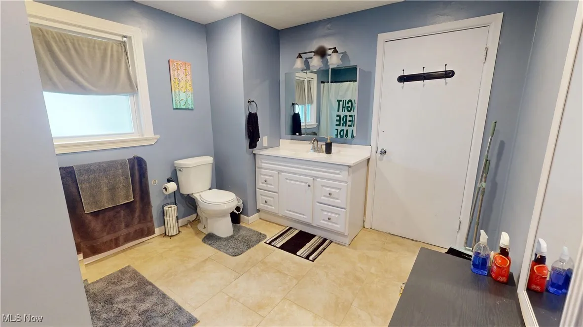 Bathroom featuring vanity and tile patterned floors
