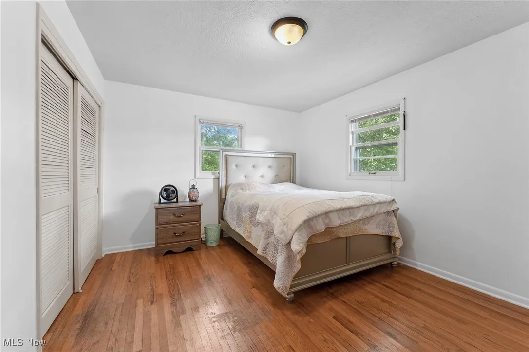 Bedroom featuring a closet and hardwood / wood-style floors