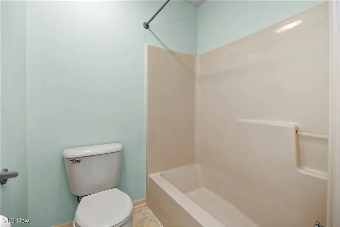 Full bathroom featuring toilet and tub / shower combination
