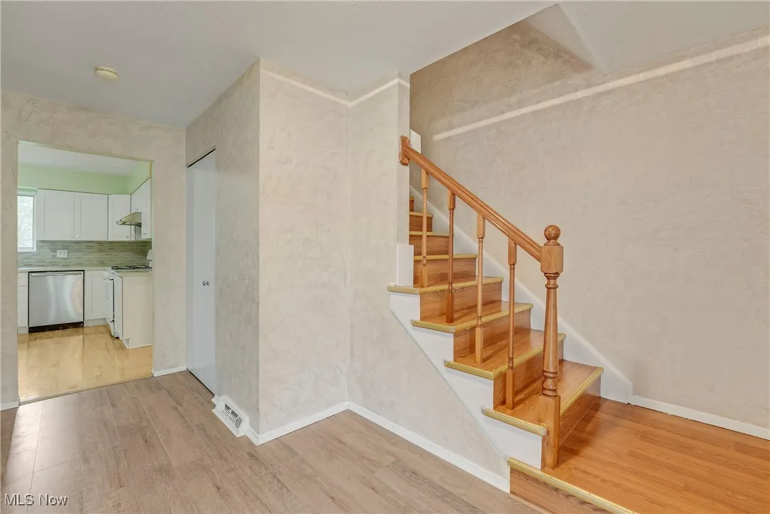 Spacious foyer featuring newer luxury vinyl flooring