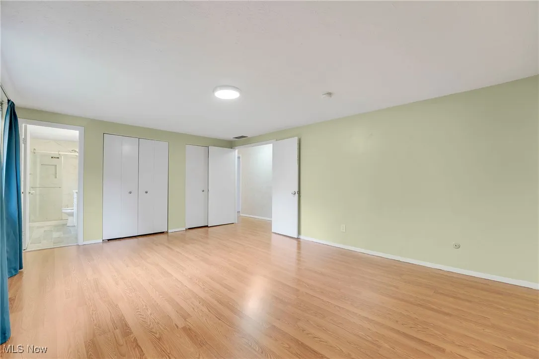 Primary suite offers a spacious bedroom, double closets, and a stylish ensuite bath
