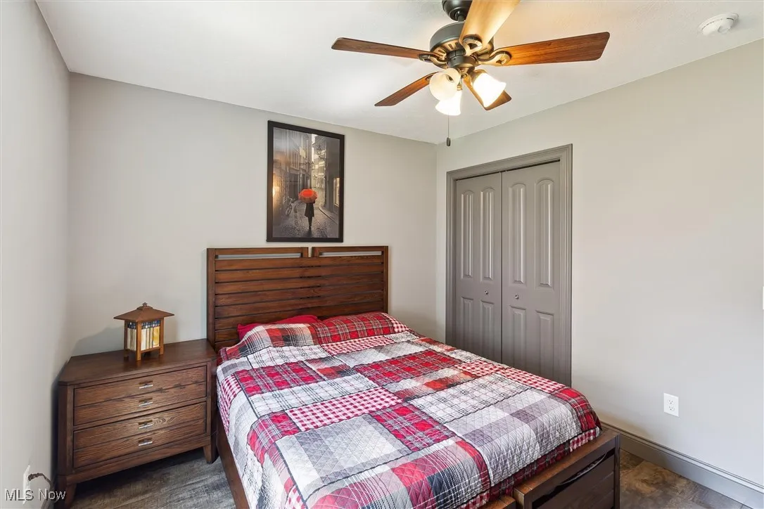 Bedroom with a closet and a ceiling fan