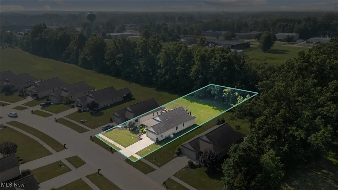 View of property location featuring property parcel outlined and a forest