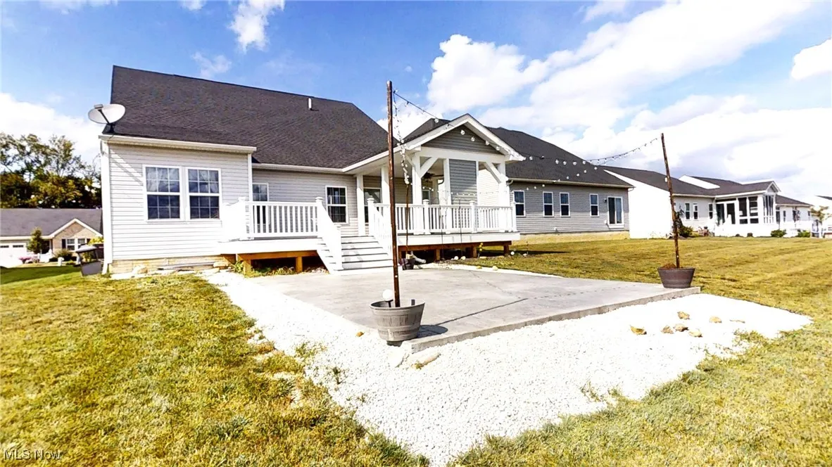 Rear View featuring deck and stamped patio