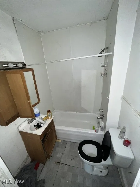 Full bathroom featuring toilet