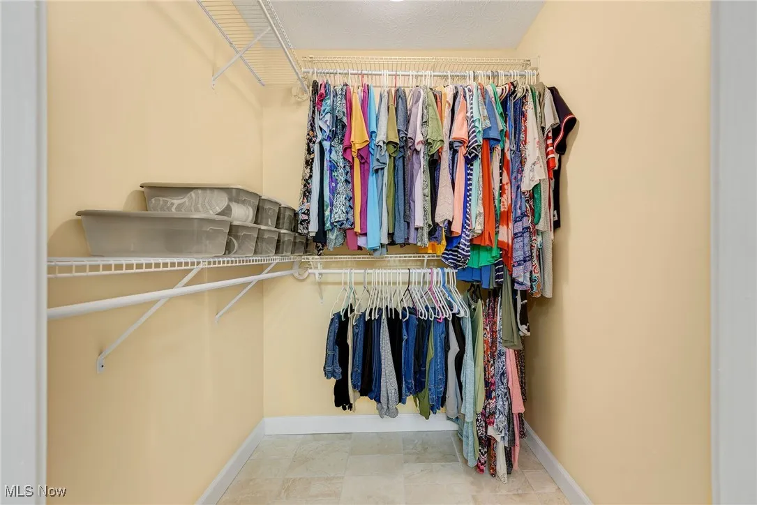 View of spacious primary walk in closet