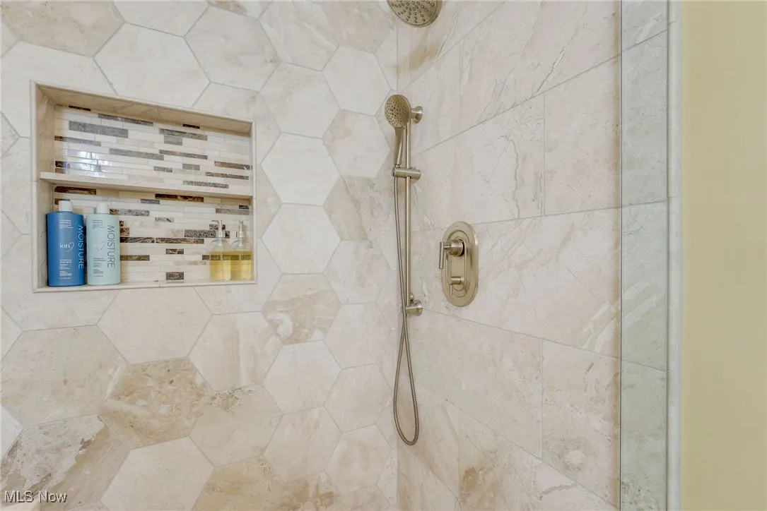 Full bathroom featuring a ceramic tile walk in shower